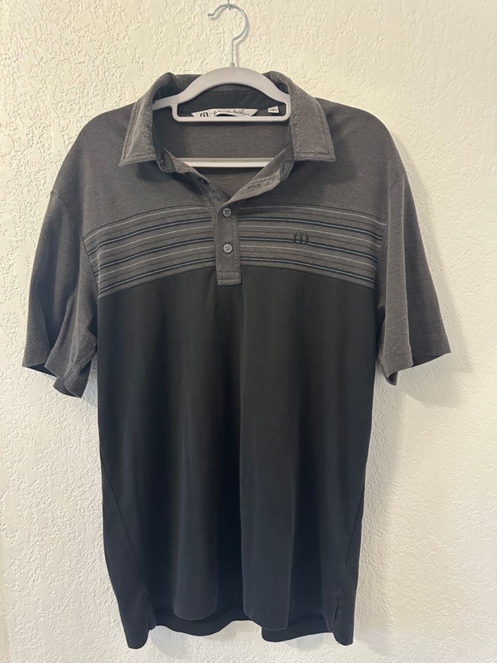 Travis Mathew Two-Tone Black and Gray Polo with Subtle Stripe Yoke
